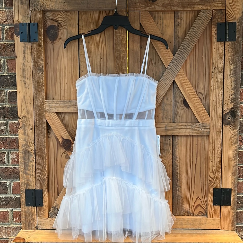 Women’s white mini cocktail dress with see through midriff and tulle on bottom